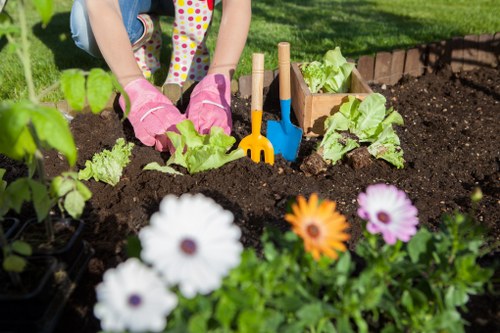 Seasonal garden maintenance activities in Turnham Green